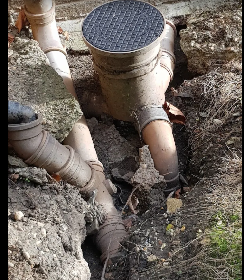 Drainage pipework at a property prepared for planned drainage maintenance